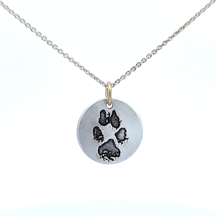 SILVER PAW PRINT DISC PENDANT